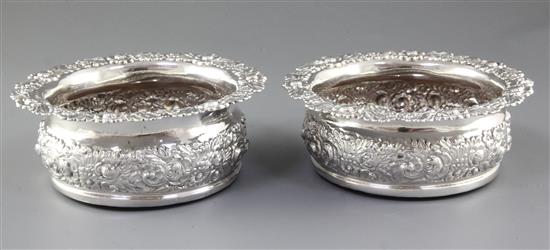 A large pair of George IV silver wine coasters, by John & Thomas Settle, diameter 174mm. Gross weight 23.5oz/736 grams